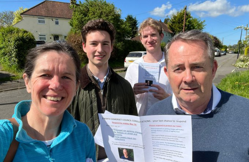 Sir Liam Fox holding a consultation leaflet